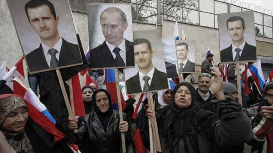 Syrians hold photos of Assad and Putin during a pro-regime protest in front of the Russian embassy in Damascus, Syria, Sunday, March 4, 2012. Photo: Freedom House/Flickr